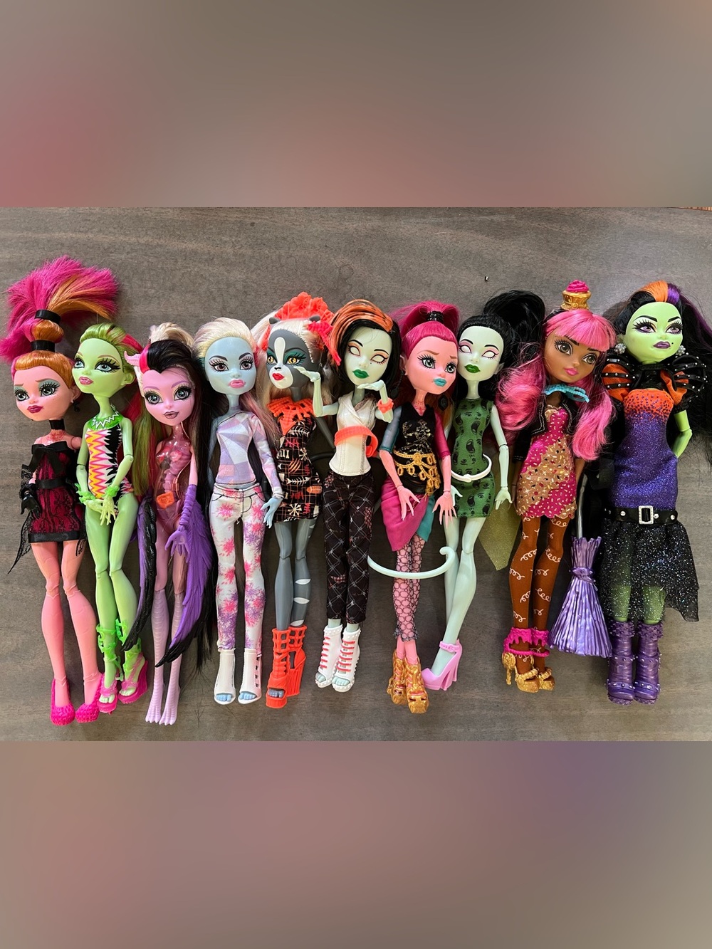 monster high dolls in green pink black orange accents